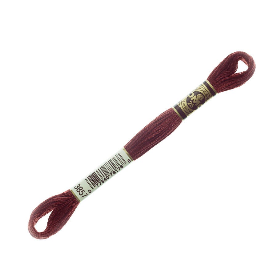 Red embroidery floss with a label on a white background