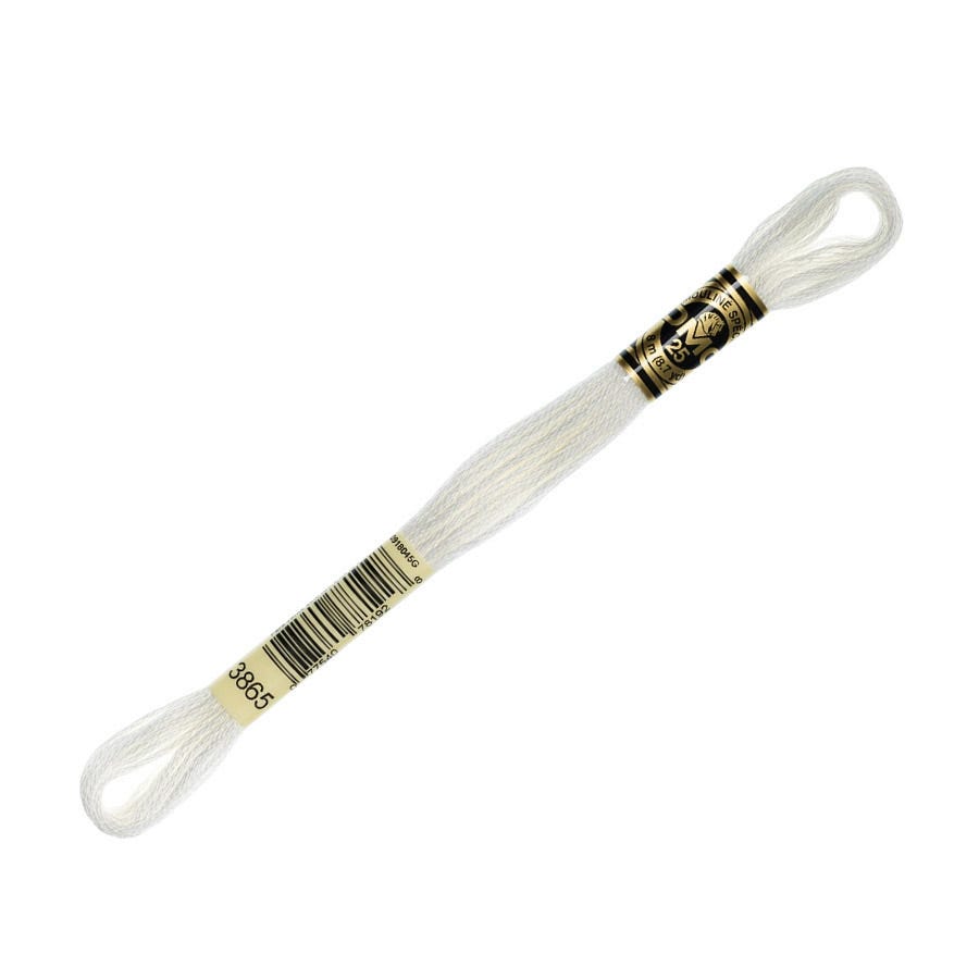 White thread with a gold spool on a white background