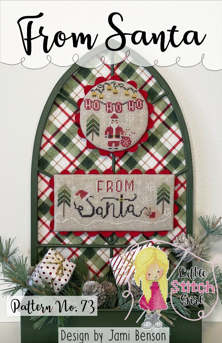 Christmas-themed cross-stitch pattern with 'From Santa' text and plaid design, featuring a small doll illustration.