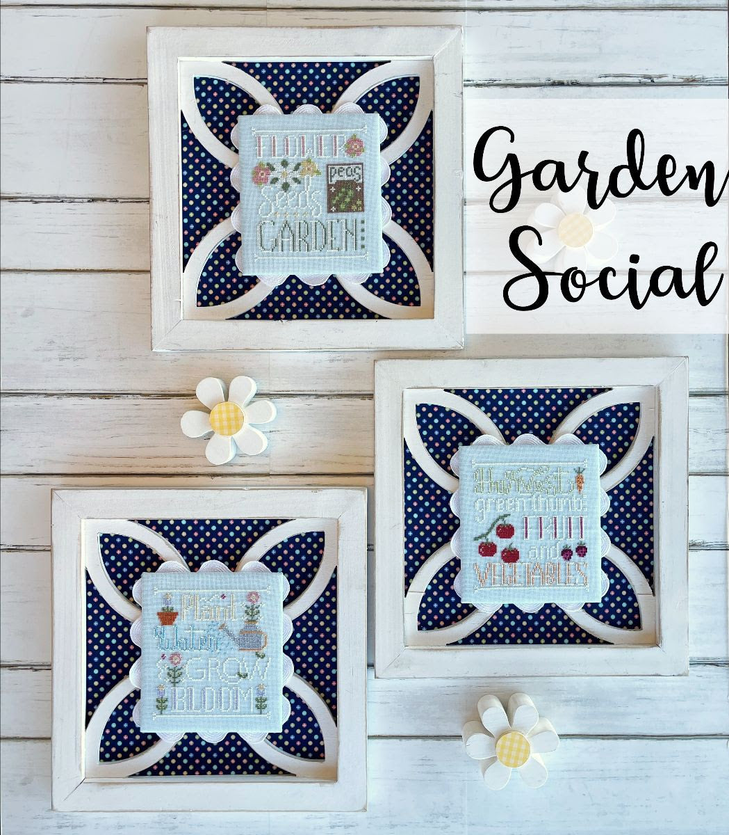 Decorative garden-themed cross-stitch frames with polka dot patterns on a wooden background.