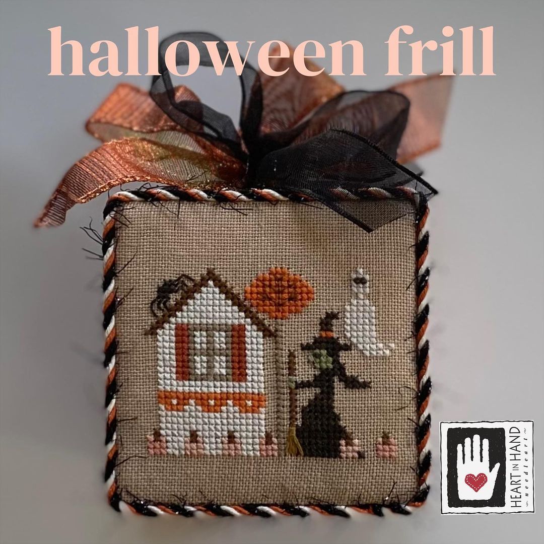 Decorative Halloween box with cross-stitch design, ribbons, and 'Heart Hand' logo.