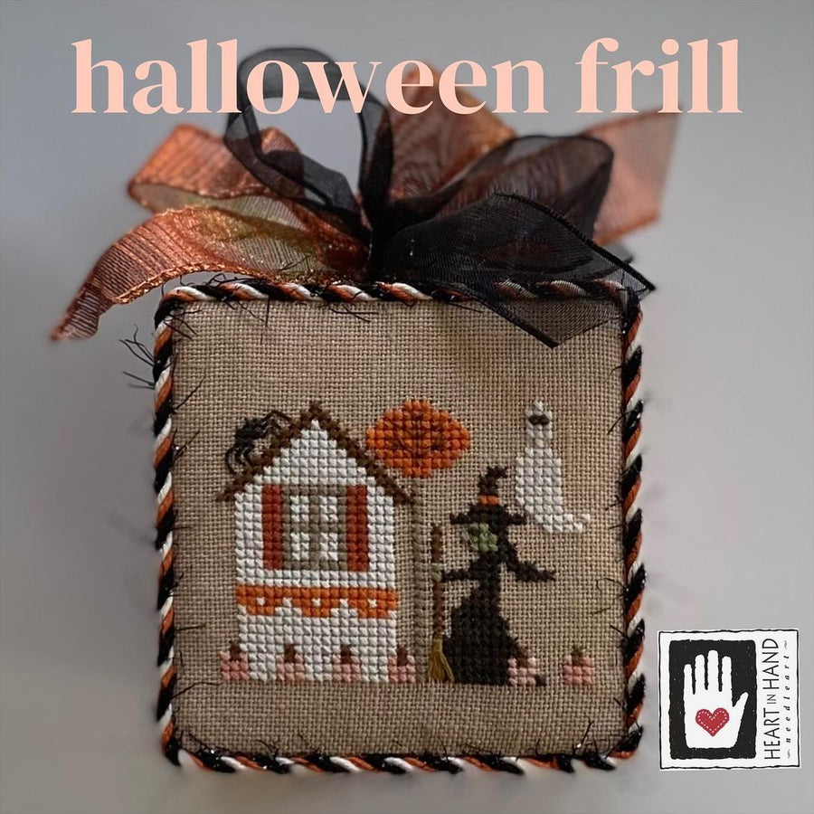 Decorative Halloween box with cross-stitch design, ribbons, and 'Heart Hand' logo.