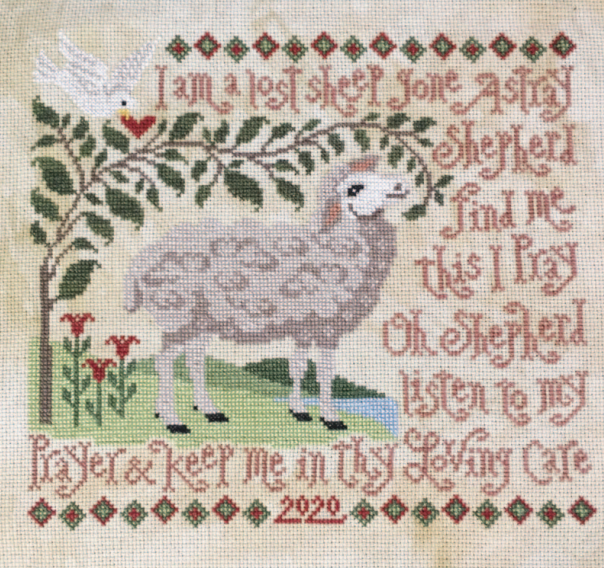 Embroidered design of a sheep with text on a white background