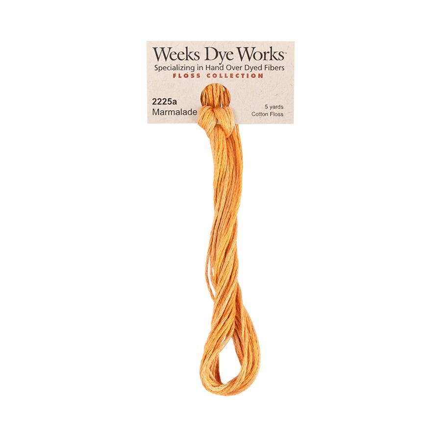 Orange floss with Weeks Dye Works label on a white background