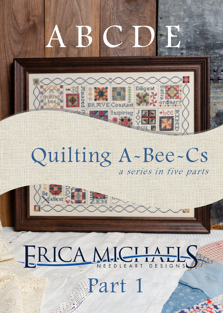 Framed cross-stitched quilt pattern with text overlay on a wooden surface