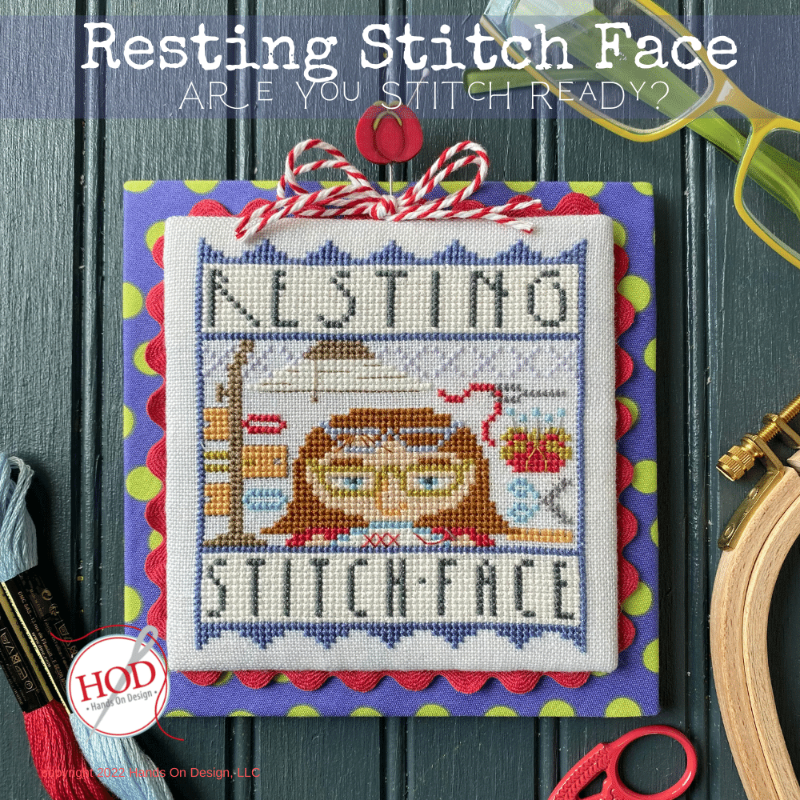 Cross-stitched face with text 'Resting Stitch Face' on a blue background, surrounded by stitching tools.