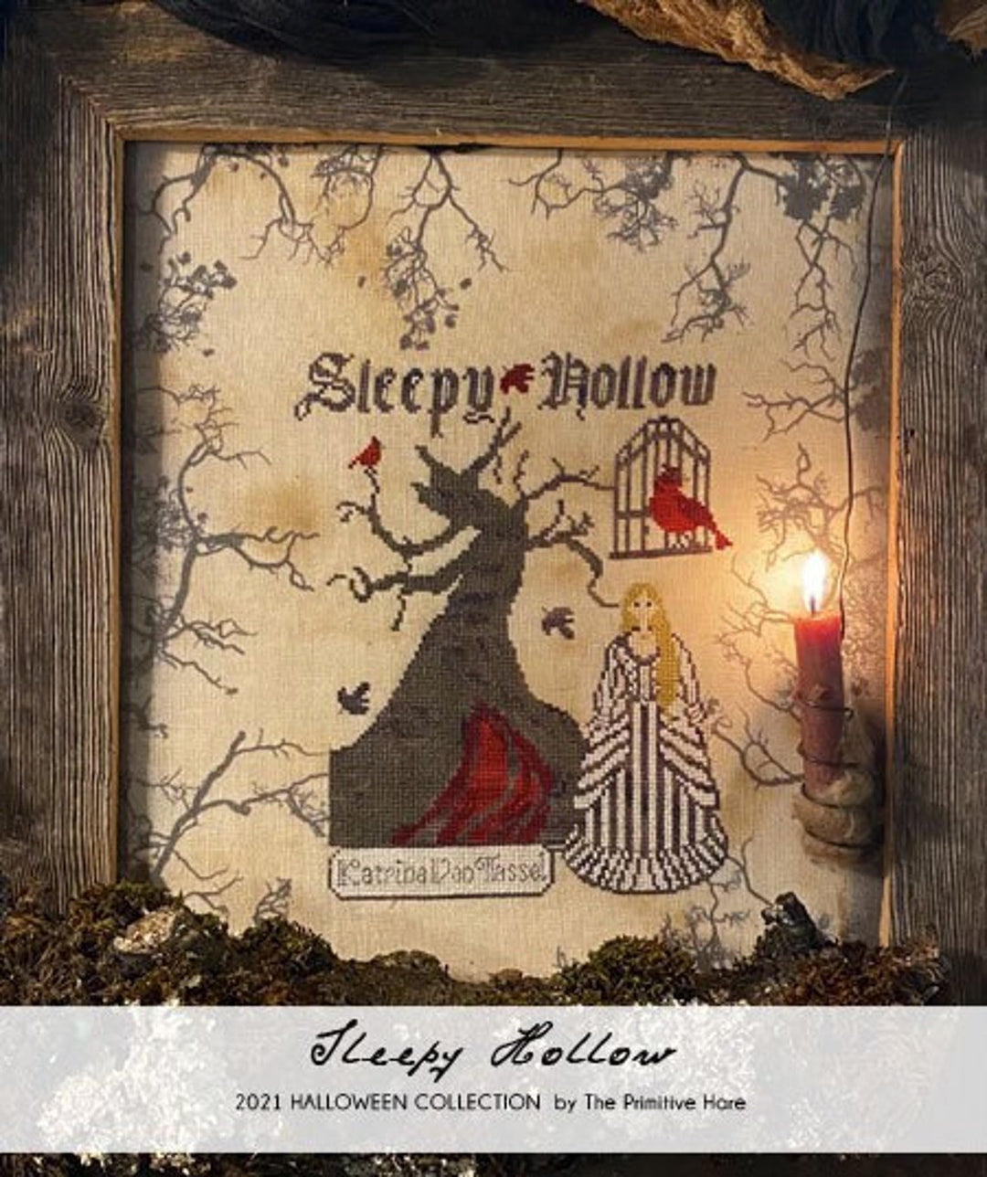 Decorative Halloween-themed cross-stitch piece with 'Sleepy Hollow' design, framed in wood.