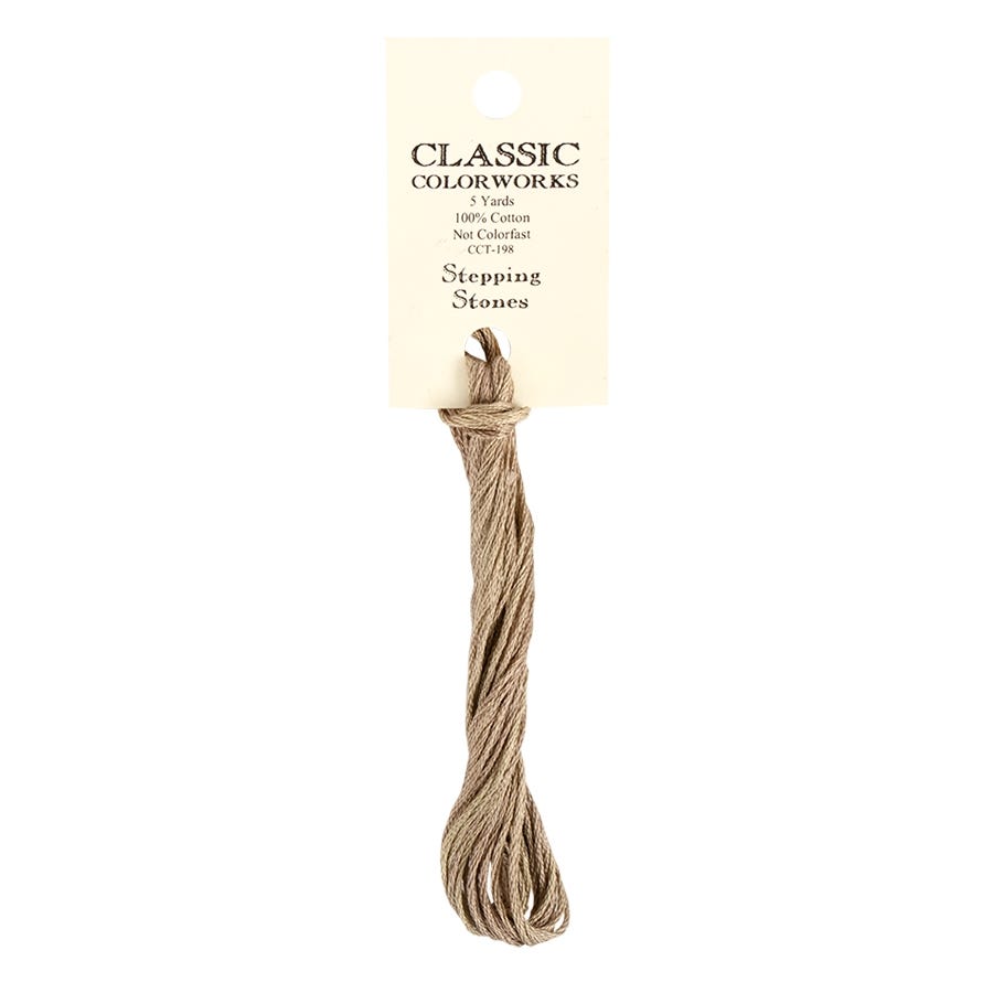 A skein of Classic Colorworks hand-dyed embroidery floss in a beige color, labeled 'Stepping Stones'.