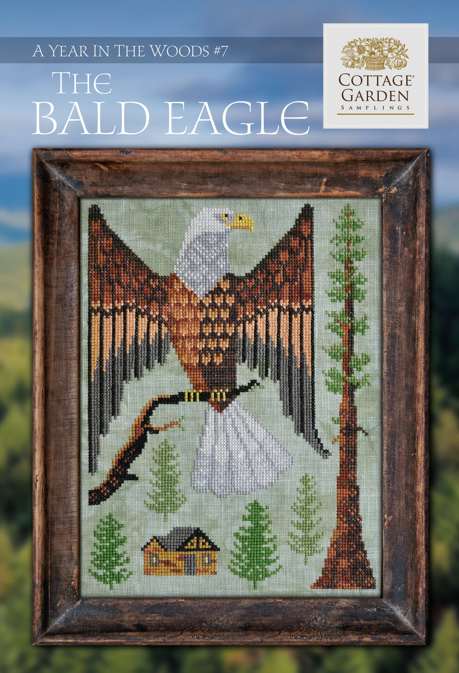A cross-stitch pattern depicting a bald eagle with trees and a house in the background, titled 'The Bald Eagle, A Year in the Woods #7 | Cottage Garden Samplings'.