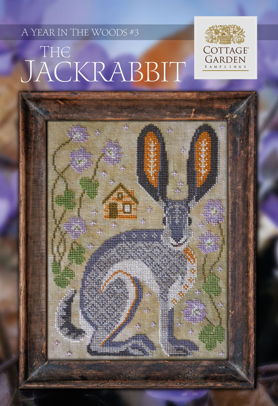 Cross stitch pattern of a jackrabbit in a floral and garden-themed design, titled 'The Jackrabbit' from 'A Year in the Woods #3' by Cottage Garden Samplings.