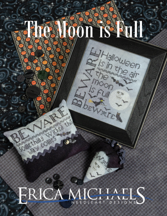 Halloween-themed cross-stitch design with text and decorative elements on a textured fabric background.