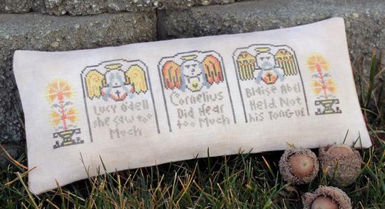 A fabric with a pattern of stitched monkey illustrations in various poses, likely intended for a decorative or crafting purpose.