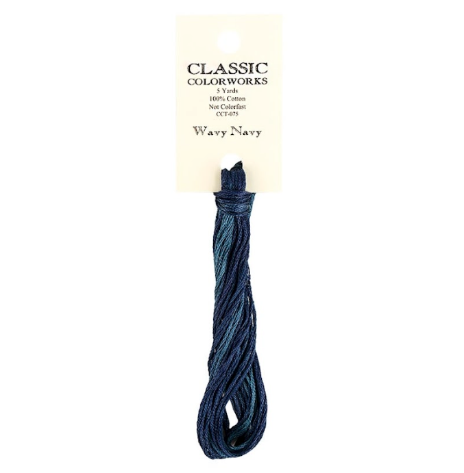 A skein of Classic Colorworks hand-dyed embroidery floss in navy color.