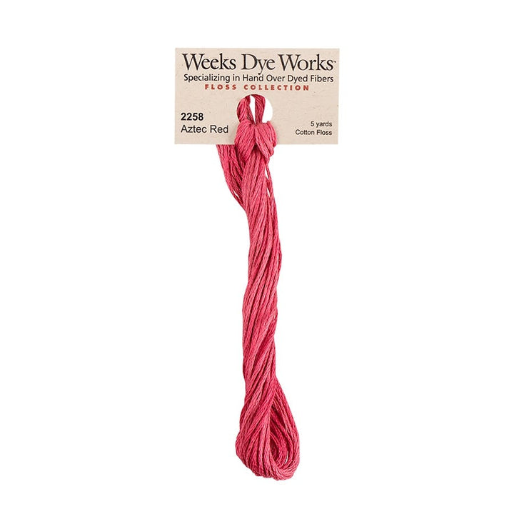 Weeks Dye Works hand-dyed cotton embroidery floss skein in aztec red 2258, a light red with pink tones