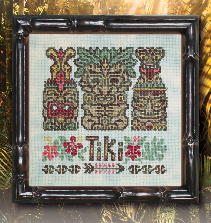 Framed cross-stitched tiki design with 'Tiki' text on a light background